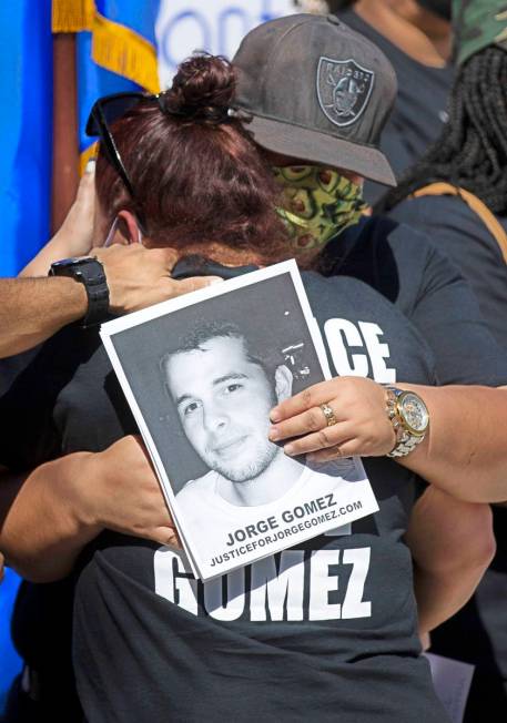Jorge Gomez's mother Jazmine Gomez receives a hug during a news conference on Wednesday, July 2 ...