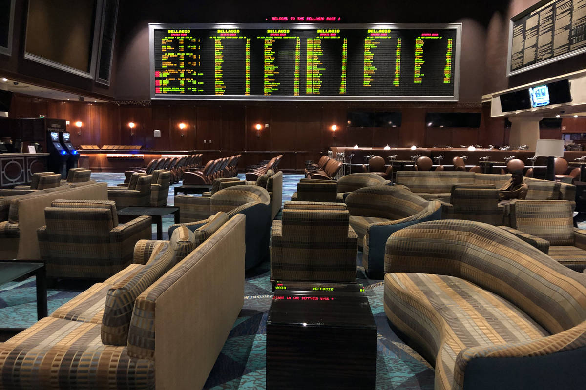 The sportsbook sits vacant within the Bellagio as MGM shuts down casino operations at midnight ...