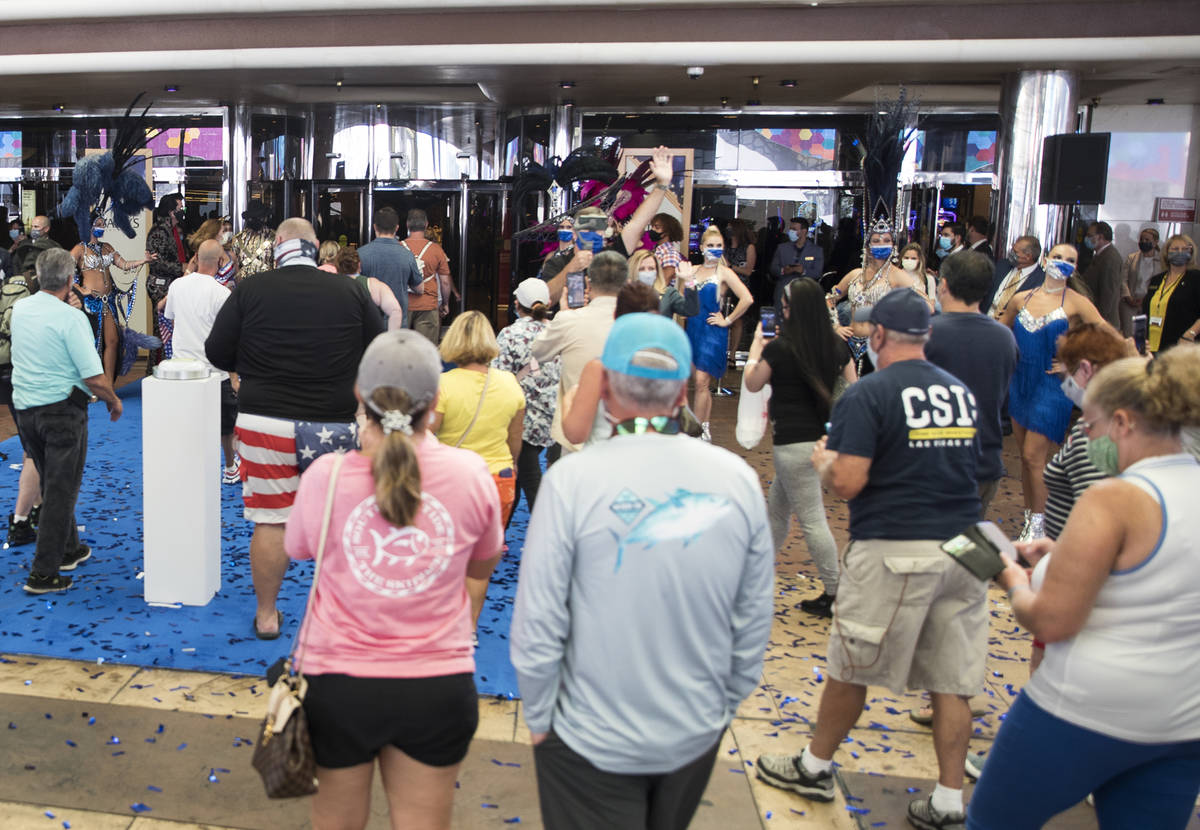 Guests enter Bally's after a reopening ceremony after a months long closure due to the coronavi ...