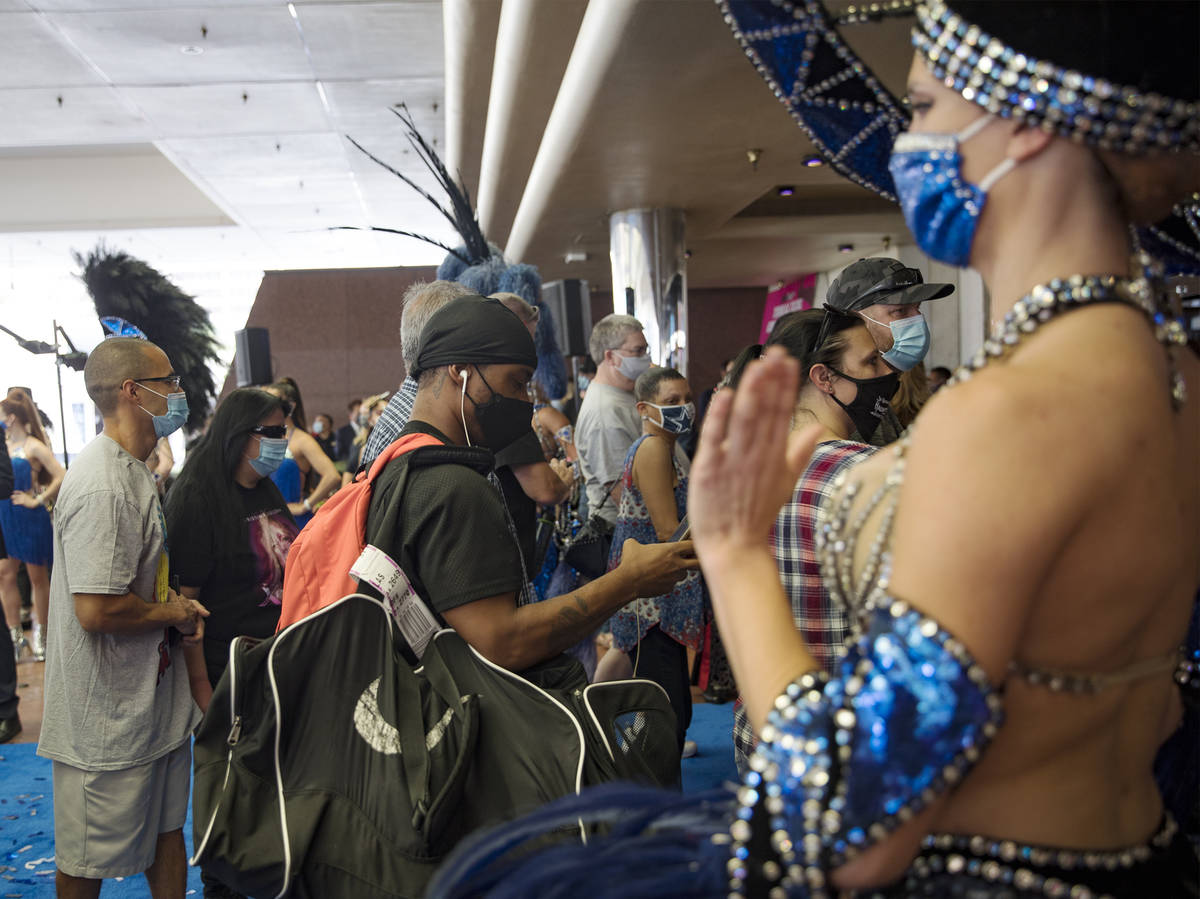 Guests enter Bally's after a reopening ceremony after a months long closure due to the coronavi ...