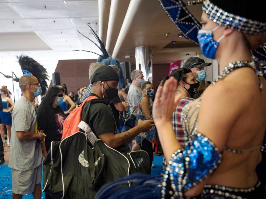 Guests enter Bally's after a reopening ceremony after a months long closure due to the coronavi ...