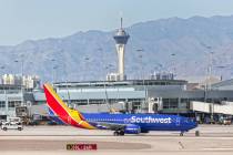 A Southwest plane taxis to its gate at McCarran International Airport on Tuesday, March 31, 202 ...
