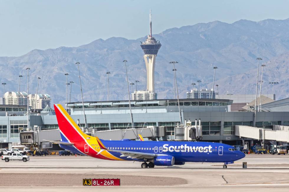 A Southwest plane taxis to its gate at McCarran International Airport on Tuesday, March 31, 202 ...