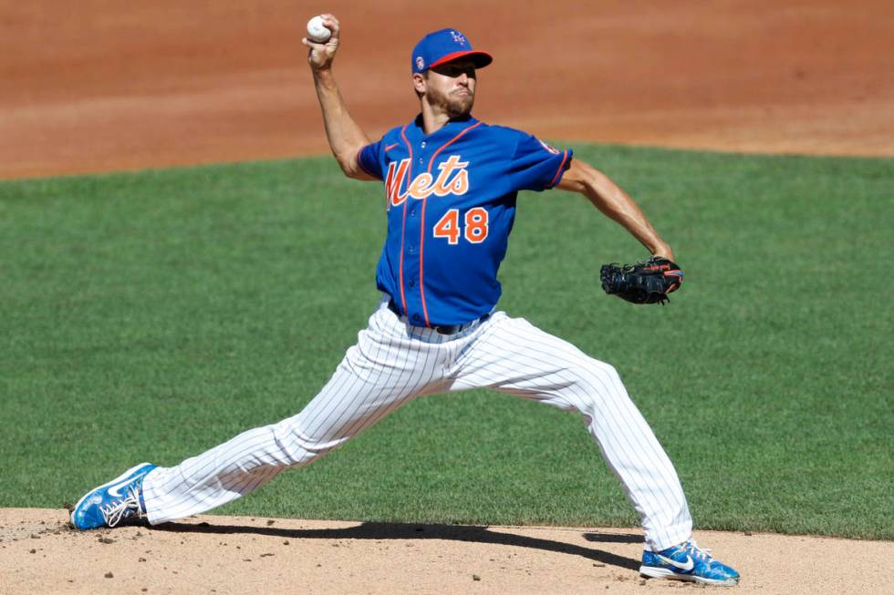 New York Mets starting pitcher Jacob deGrom winds up during a simulated game, part of the Mets ...