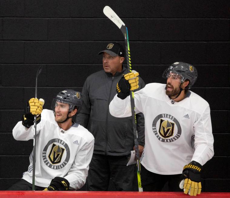 Golden Knights' forward Nicolas Roy (10), left, assistant coach Steve Spott, center, and forwar ...