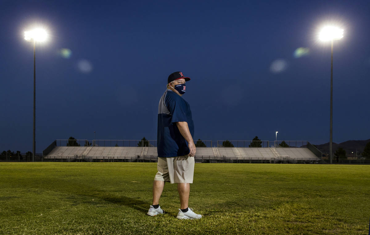Liberty High School football coach Rich Muraco stands on the empty football field on Thursday, ...