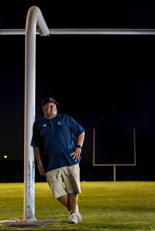 Liberty High School football coach Rich Muraco at the goalpost on the empty football field on T ...