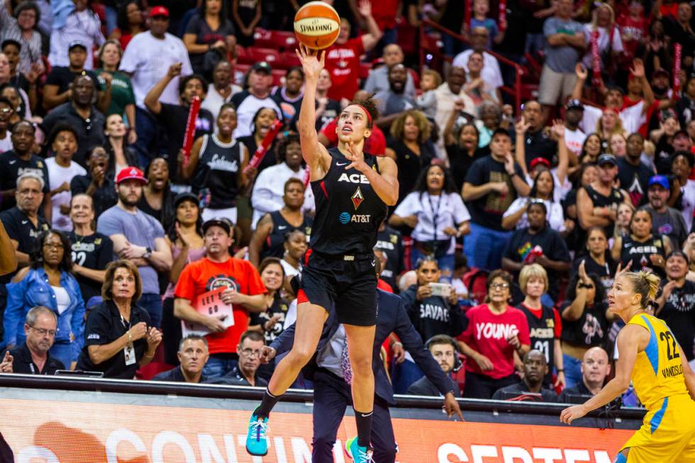 Las Vegas Aces forward Dearica Hamby (5) makes a late-game three-point-shot over the Chicago Sk ...