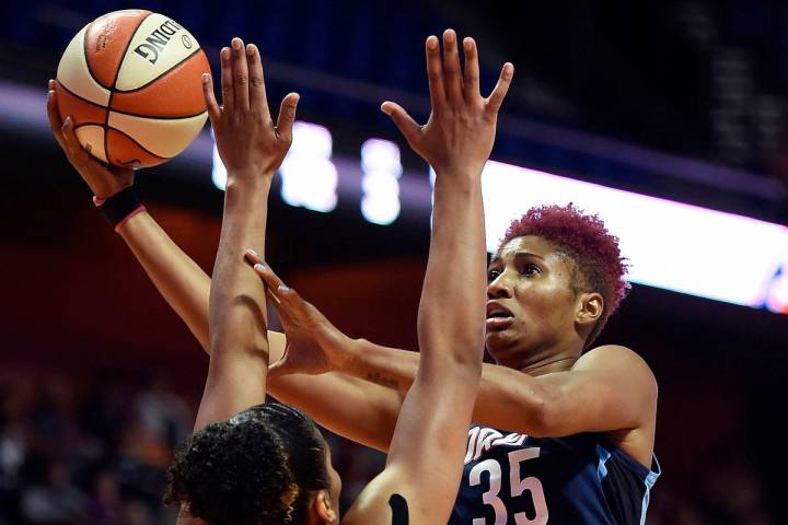 Atlanta Dream forward Angel McCoughtry shoots over Connecticut Sun forward Alyssa Thomas during ...