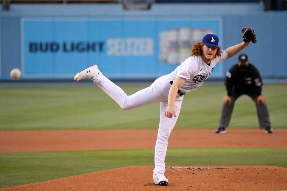 Los Angeles Dodgers starting pitcher Dustin May throws to the plate during the first inning of ...
