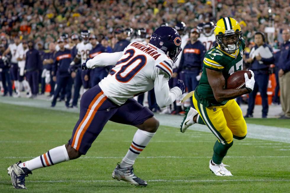 Green Bay Packers' Davante Adams catches a touchdown pass with Chicago Bears' Prince Amukamara ...