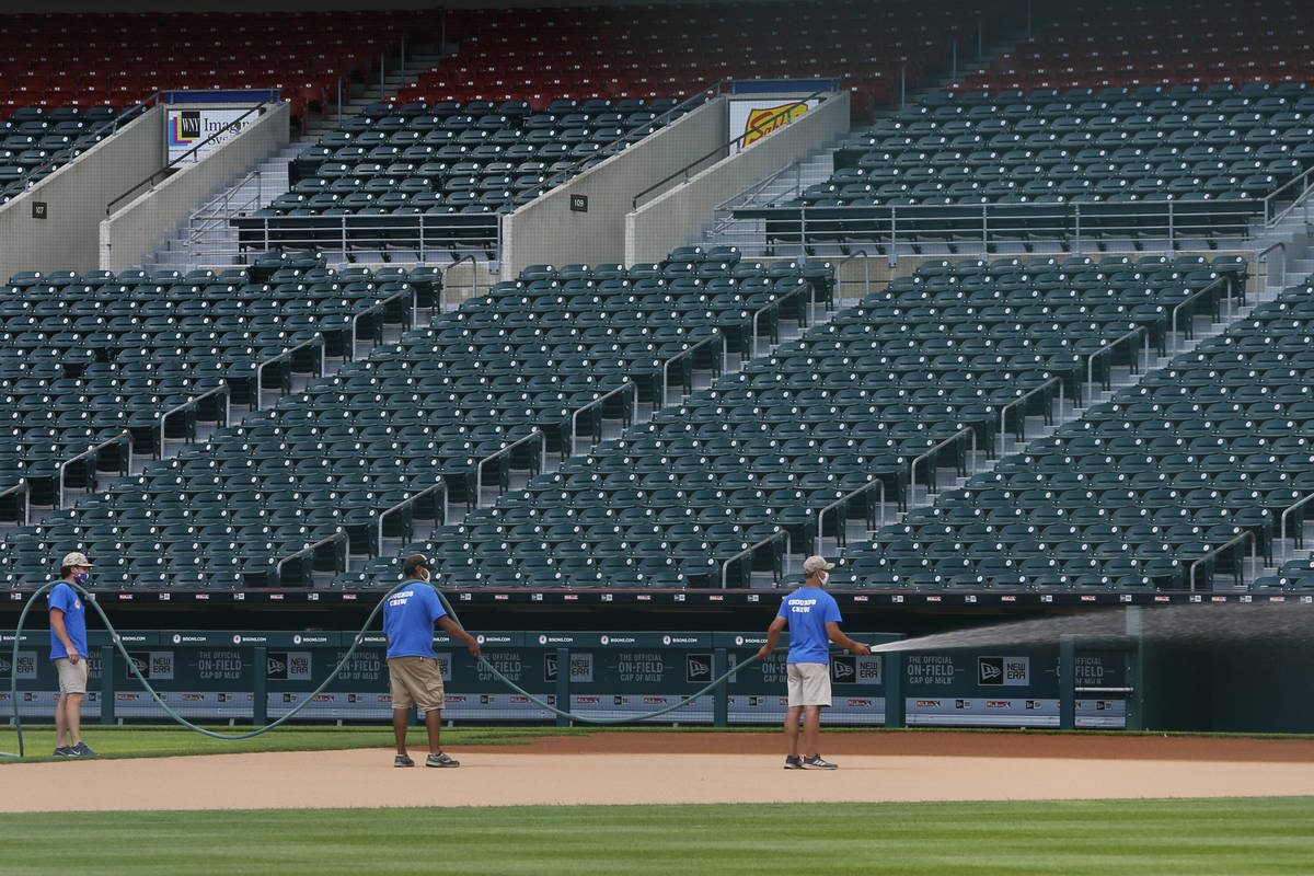 Grounds crew work on field following the announcement that the Toronto Blue Jays will play thei ...