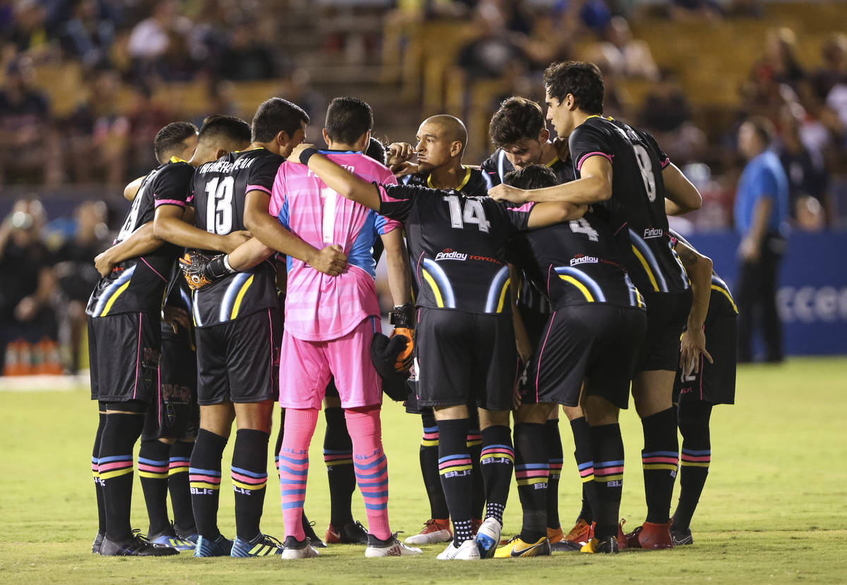 The Light FC huddle on the field before playing the Phoenix Rising FC in a United Soccer League ...