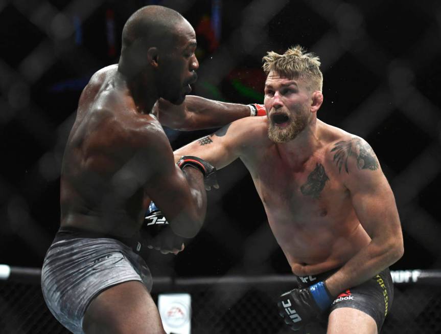 Alexander Gustafsson, right, lands a punch to Jon Jones during the UFC men's light heavyweight ...