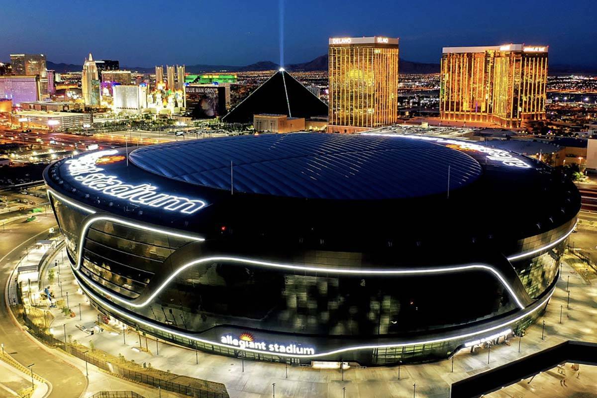 Allegiant Stadium lit up at night. (Michael Cerdeiros/ Las Vegas Raiders)