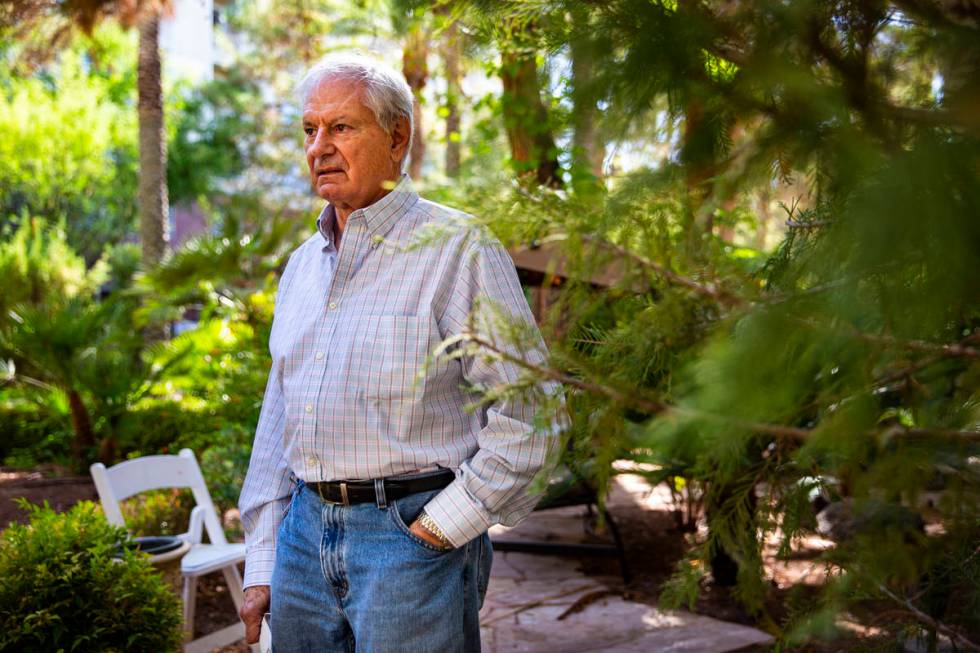 Photographer Dave Cherkis poses for a portrait by the Rampart Casino at the Resort at Summerlin ...