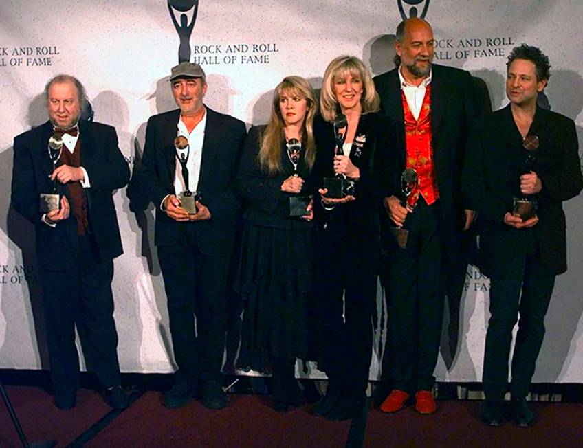 In this file photo dated Monday, Jan. 12, 1998 Members of Fleetwood Mac hold their awards after ...