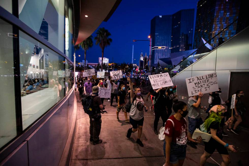 People participate during a Black Lives Matter rally on the Las Vegas Strip on Saturday, July 2 ...