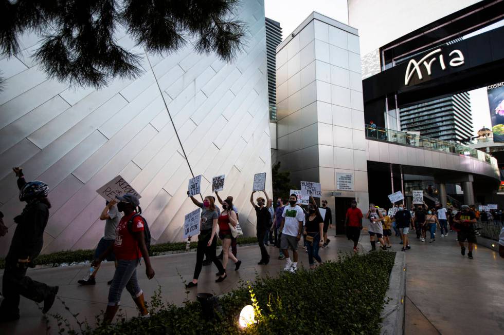 People participate during a Black Lives Matter rally on the Las Vegas Strip on Saturday, July 2 ...