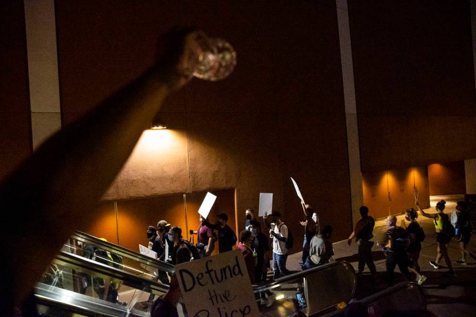 People participate during a Black Lives Matter rally on the Las Vegas Strip on Saturday, July 2 ...