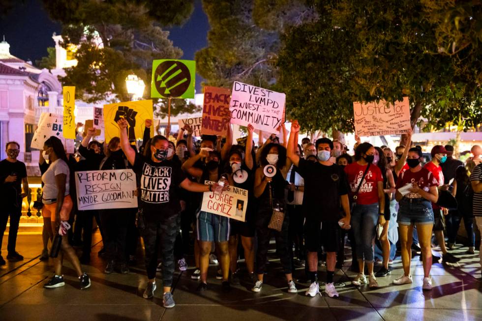 People participate during a Black Lives Matter rally on the Las Vegas Strip on Saturday, July 2 ...