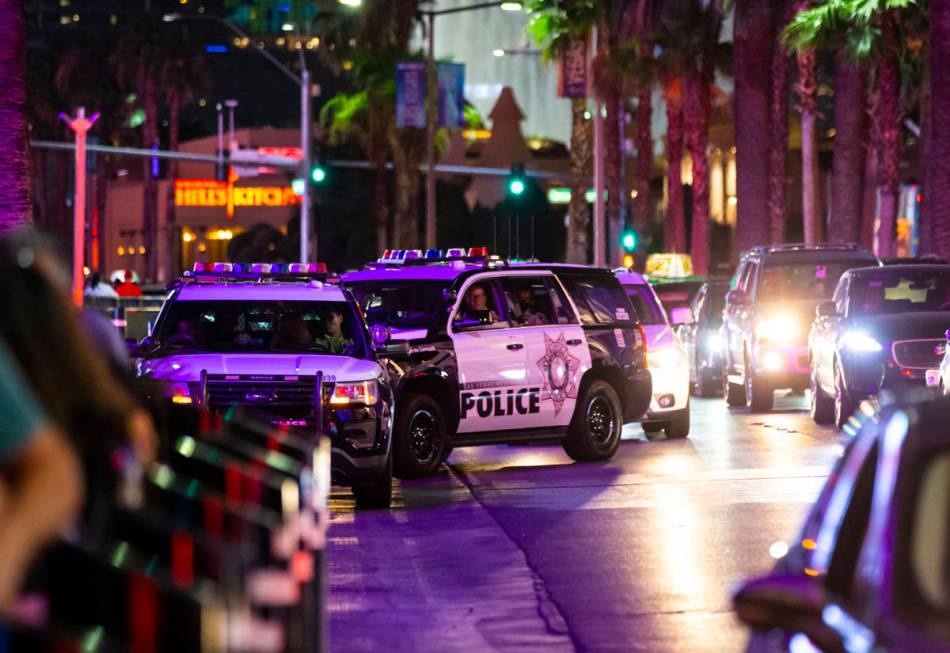 Las Vegas police watch people march during a Black Lives Matter rally on the Las Vegas Strip on ...