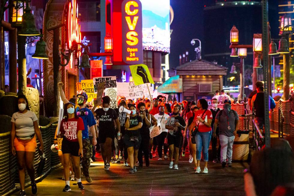 People march during a Black Lives Matter rally on the Las Vegas Strip on Saturday, July 25, 202 ...