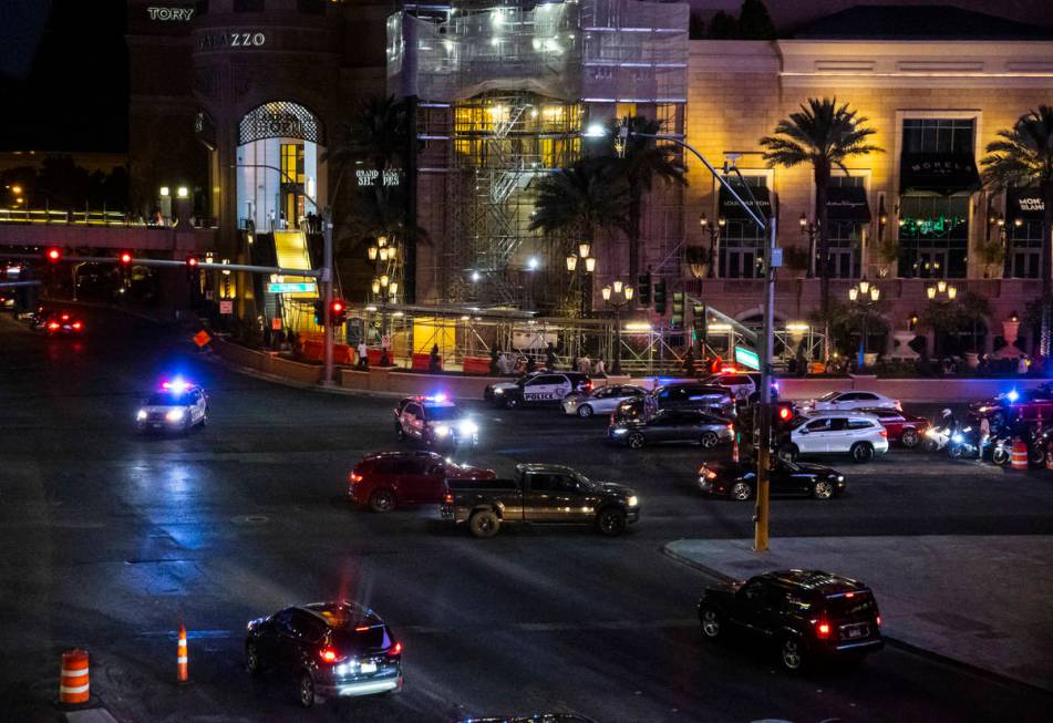 Las Vegas police gather nearby during a Black Lives Matter rally on the Las Vegas Strip on Satu ...