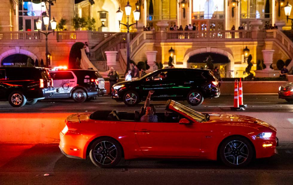 People in a car cheer during a Black Lives Matter rally on the Las Vegas Strip on Saturday, Jul ...