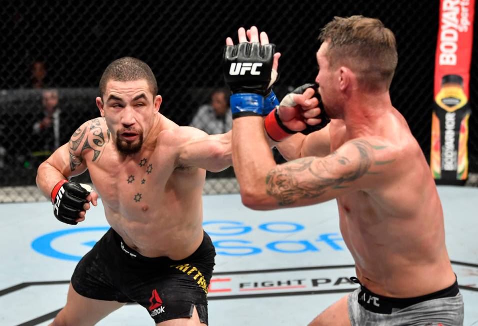 ABU DHABI, UNITED ARAB EMIRATES - JULY 26: (L-R) Robert Whittaker of New Zealand punches Darren ...