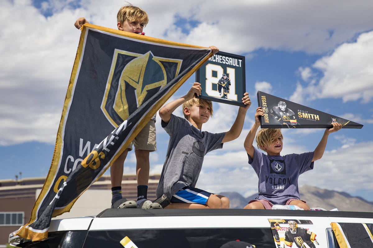 Brothers Colton Zahn, 9, from left, Brayden Zahn, 7, and his twin Brooks Zahn, 7, wait for the ...