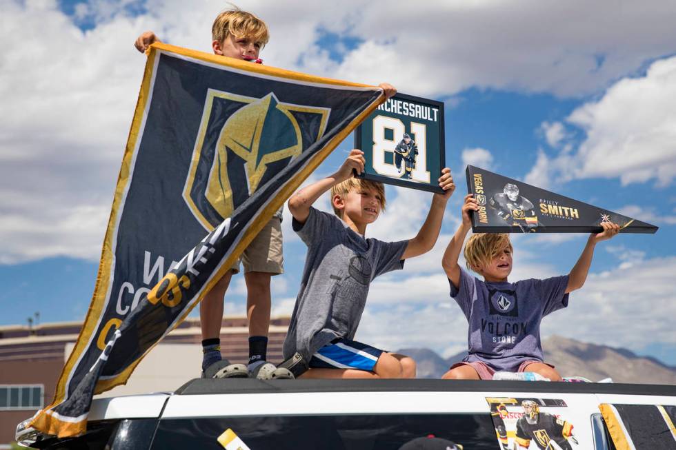 Brothers Colton Zahn, 9, from left, Brayden Zahn, 7, and his twin Brooks Zahn, 7, wait for the ...