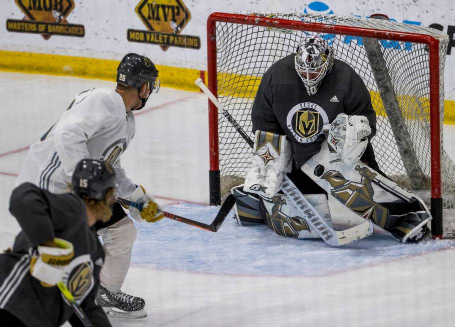 Vegas Golden Knights center Paul Stastny (26, left) has a shot stopped by goaltender Robin Lehn ...