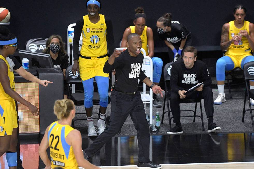 Chicago Sky head coach James Wade, center, reacts after a play during the first half of a WNBA ...