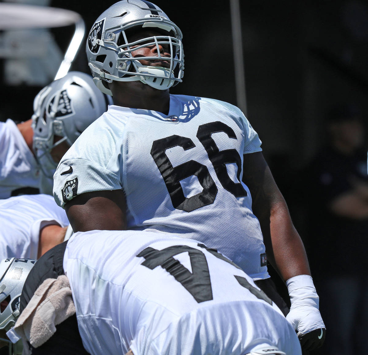 Oakland Raiders offensive guard Gabe Jackson (66) stretches during a mandatory mini-camp workou ...