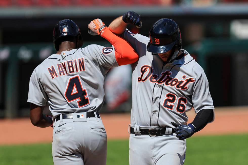 Detroit Tigers' C.J. Cron (26) celebrates with Cameron Maybin (4) after hitting a two-run home ...