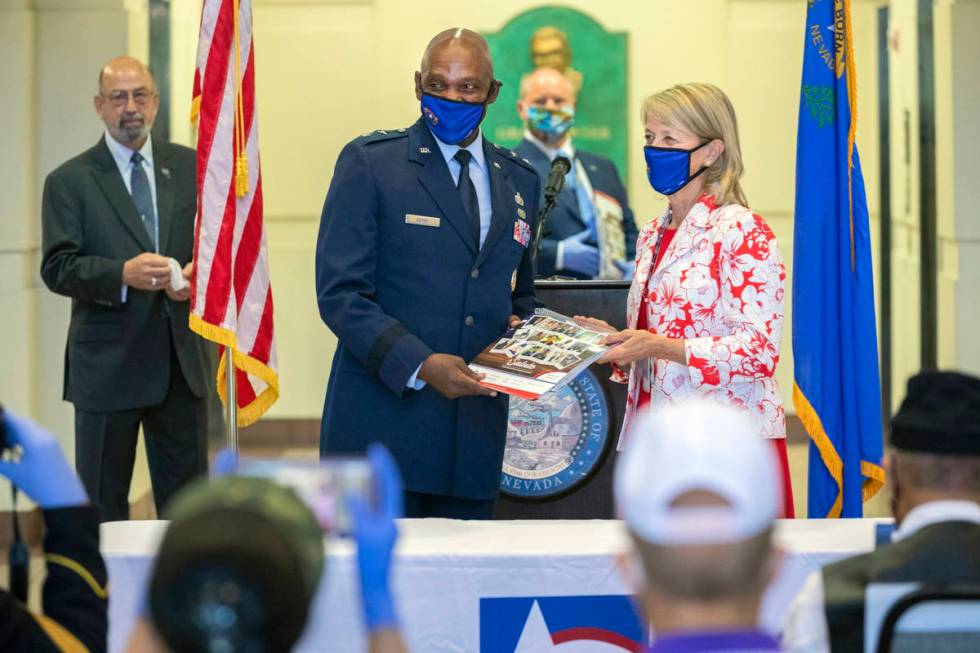 Maj. Gen. Ondra Berry is honored by Nevada Secretary of State Barbara Cegavske during a service ...