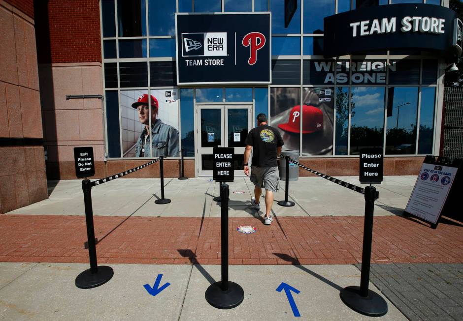 A person walks toward the Philadelphia Phillies team store at Citizens Bank Park on Monday, Jul ...
