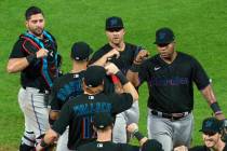 In this Friday, July 24, 2020, file photo, Miami Marlins' Jesus Aguilar, right, celebrates a 5- ...