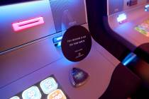 A slot machine is turned off for social distancing during a media a tour showing "health a ...
