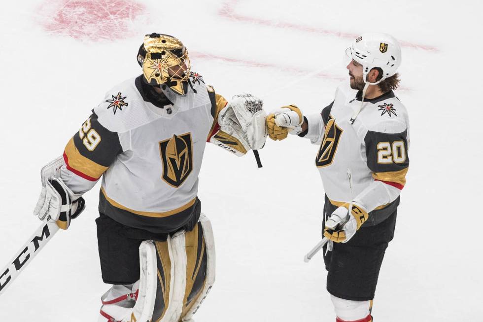 Vegas Golden Knights goalie Marc-Andre Fleury (29) and teammate Chandler Stephenson (20) celebr ...