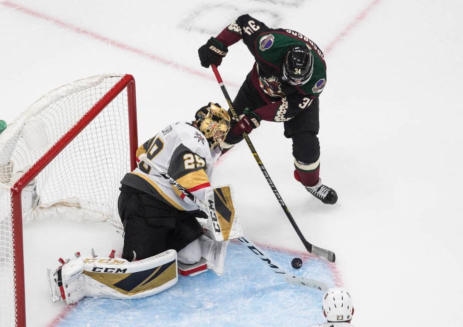 Arizona Coyotes' Carl Soderberg (34) is stopped by Vegas Golden Knights goalie Marc-Andre Fleur ...