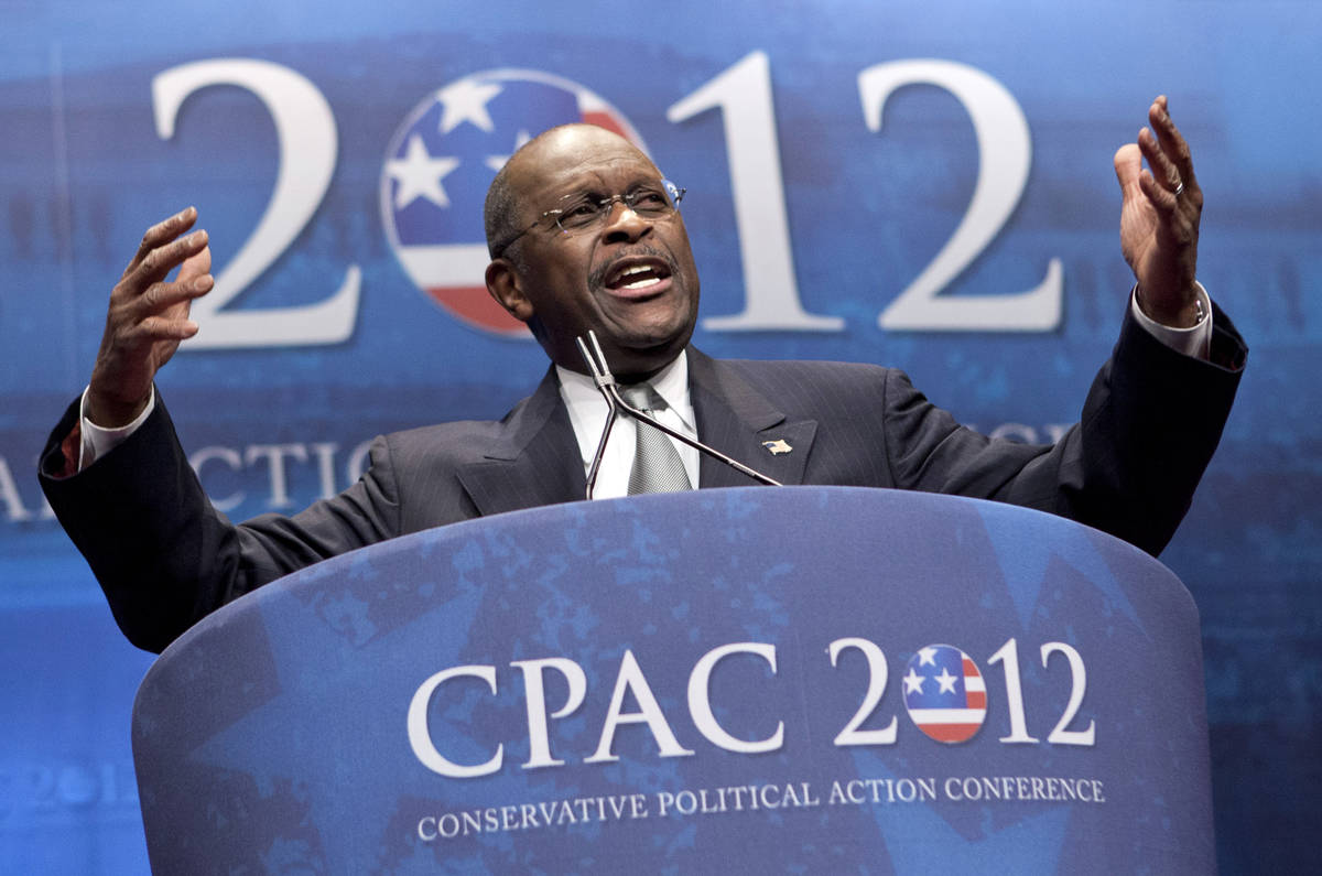 Former presidential candidate Herman Cain addresses the Conservative Political Action Conferenc ...