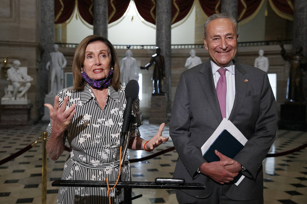 House Speaker Nancy Pelosi of Calif., left, and Senate Minority Leader Sen. Chuck Schumer of N. ...