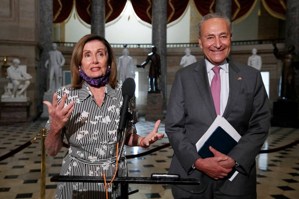 House Speaker Nancy Pelosi of Calif., left, and Senate Minority Leader Sen. Chuck Schumer of N. ...