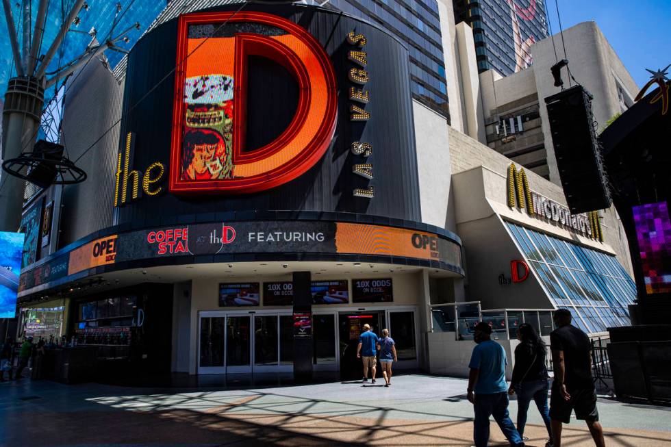 People walk outside of the D Las Vegas at the Fremont Street Experience in downtown Las Vegas o ...