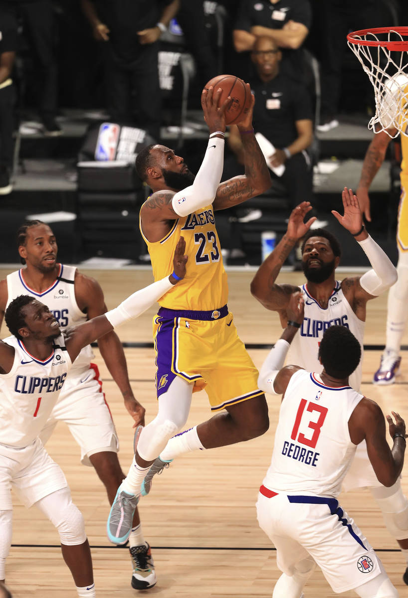 Los Angeles Lakers' LeBron James (23) makes a shot against the Los Angeles Clippers during the ...