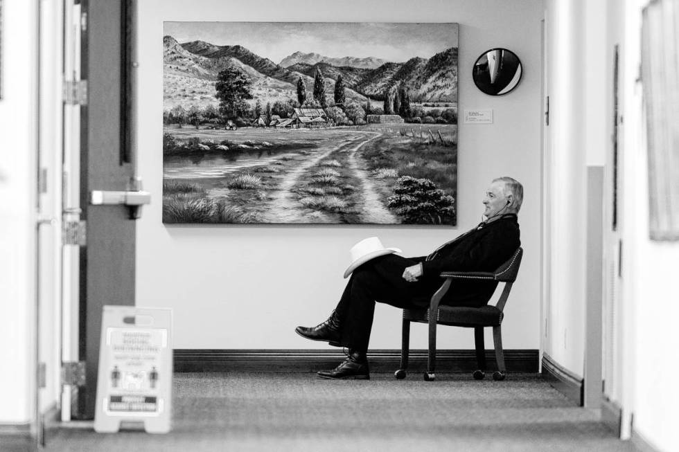 Senate Minority Leader James Settelmeyer makes a phone call outside his office on Friday, July ...