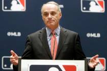 In this Nov. 21, 2019, file photo, baseball commissioner Rob Manfred speaks to the media at the ...