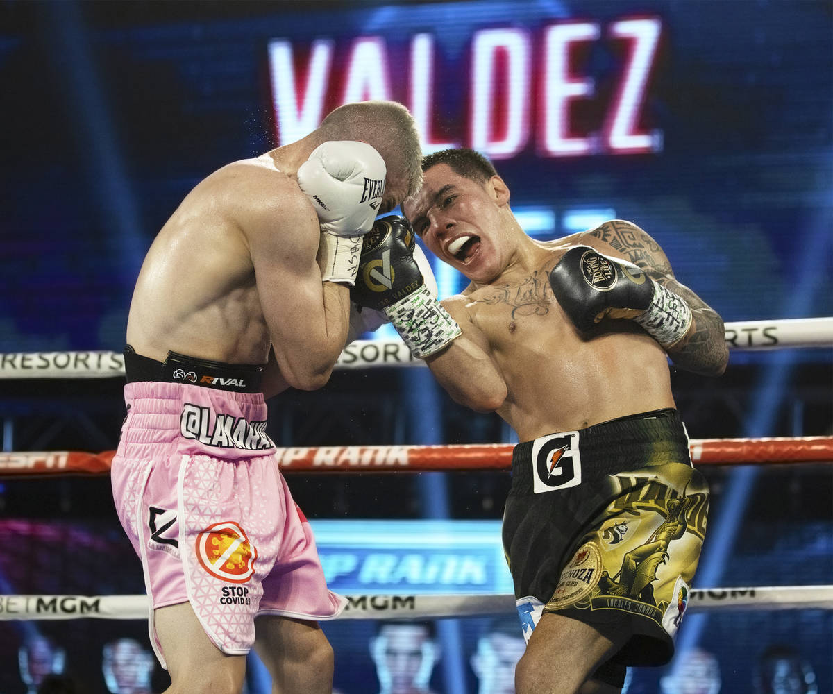 Oscar Valdez, right, lands an upper cut against Jayson Velez during their jr. lightweight fight ...